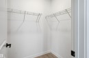 Spacious closet with light wood-style floors - 317 Juniper Cove, Leduc, AB  - Indoor With Storage 