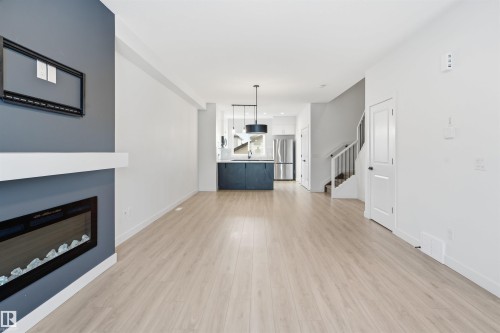 317 Juniper Cove, Leduc, AB - Indoor Photo Showing Living Room With Fireplace