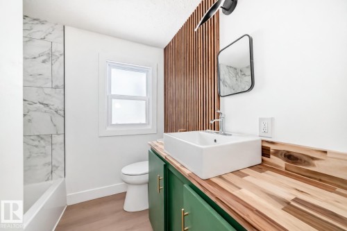 Full bathroom with vanity and light wood finished floors - 8712 89 Avenue, Edmonton, AB - Indoor Photo Showing Bathroom