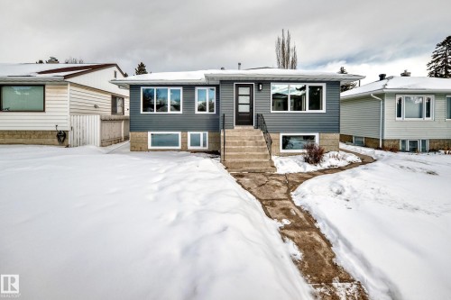 View of snow covered rear of property - 8712 89 Avenue, Edmonton, AB - Outdoor With Facade