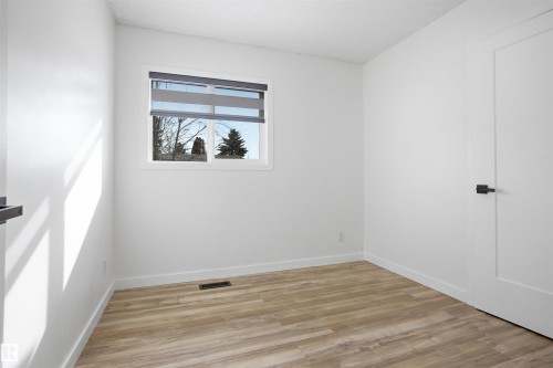 Spare room with light wood finished floors and baseboards - 4204 41B Street, Leduc, AB - Indoor Photo Showing Other Room