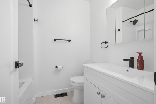 Full bath featuring vanity and toilet - 4204 41B Street, Leduc, AB - Indoor Photo Showing Bathroom