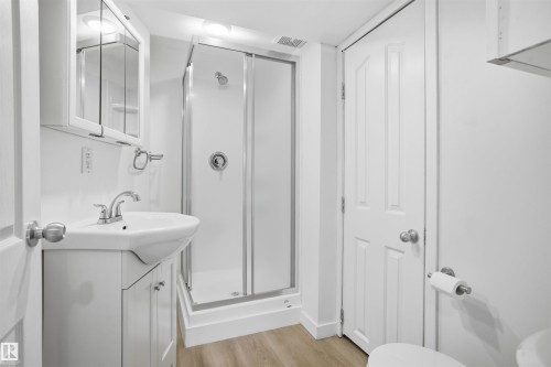 Full bath with vanity, a stall shower, and light wood finished floors - 4204 41B Street, Leduc, AB - Indoor Photo Showing Bathroom