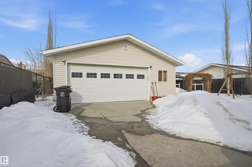 View of front of house featuring an outdoor structure and a detached garage - 4204 41B Street, Leduc, AB - Outdoor