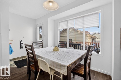 Dining area featuring baseboards and dark wood-style flooring - 4519 Turner Square Square, Edmonton, AB - Indoor Photo Showing Dining Room
