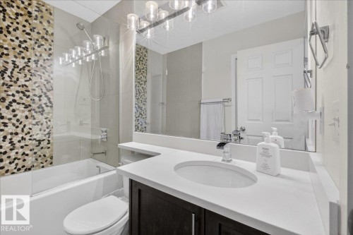 Bathroom featuring vanity and shower / bath combo - 4519 Turner Square Square, Edmonton, AB - Indoor Photo Showing Bathroom