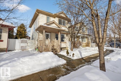 View of front of house featuring a gate and a wooden deck - 4519 Turner Square Square, Edmonton, AB - Outdoor With Facade