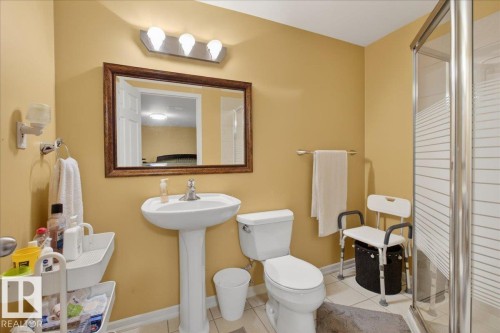 Full bath with a stall shower and light tile patterned flooring - 4519 Turner Square Square, Edmonton, AB - Indoor Photo Showing Bathroom