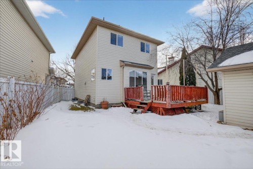 Snow covered back of property featuring a deck - 4519 Turner Square Square, Edmonton, AB - Outdoor With Deck Patio Veranda With Exterior