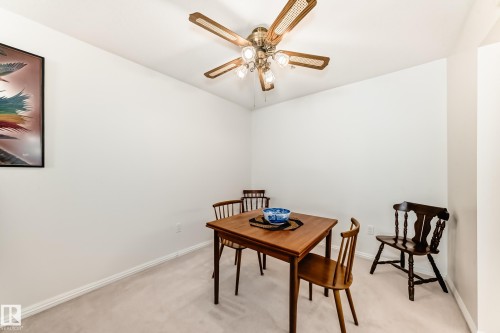 Dining room featuring light colored carpet and ceiling fan - 118 6220 Fulton Road, Edmonton, AB - Indoor