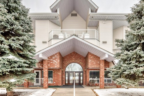 Doorway to property featuring brick siding and french doors - 118 6220 Fulton Road, Edmonton, AB - Outdoor