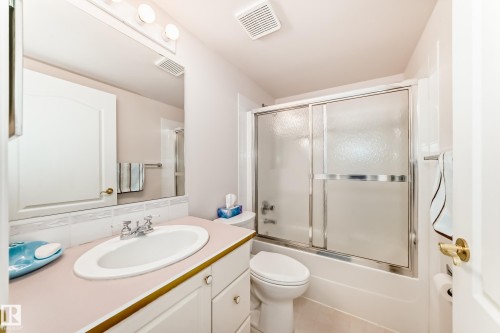 Full bathroom with vanity and bath / shower combo with glass door - 118 6220 Fulton Road, Edmonton, AB - Indoor Photo Showing Bathroom