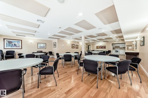 Dining room with light wood-style flooring, recessed lighting, and coffered ceiling - 118 6220 Fulton Road, Edmonton, AB - Indoor Photo Showing Dining Room