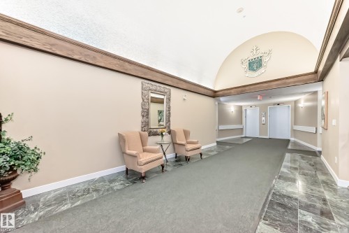Community lobby with a barrel ceiling - 118 6220 Fulton Road, Edmonton, AB - Indoor Photo Showing Other Room