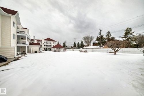 Snowy yard featuring a patio area - 118 6220 Fulton Road, Edmonton, AB - Outdoor
