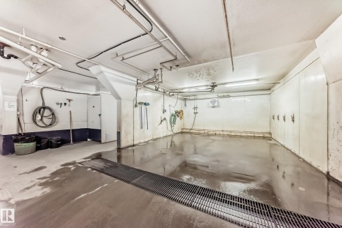 View of garage with car wash - 118 6220 Fulton Road, Edmonton, AB - Indoor Photo Showing Garage