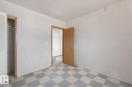 Unfurnished bedroom featuring light floors and a closet - 5219 51 Avenue, Wetaskiwin, AB - Indoor Photo Showing Other Room