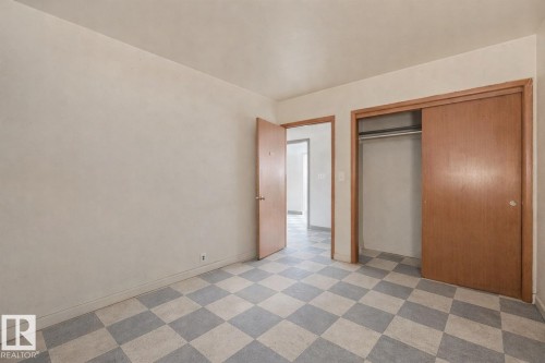 Unfurnished bedroom with light flooring and a closet - 5219 51 Avenue, Wetaskiwin, AB - Indoor Photo Showing Other Room