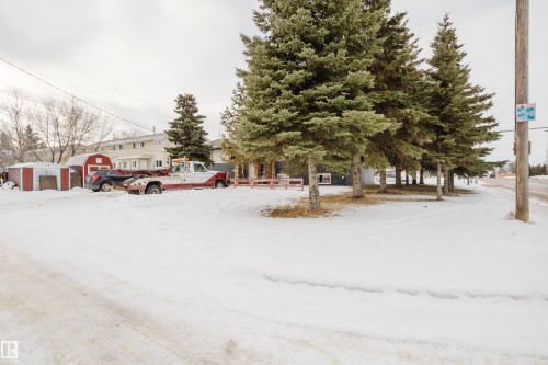 Snowy yard with a shed - 3917/3919 54 Street, Wetaskiwin, AB - Outdoor