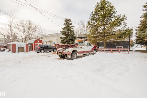 Snow covered parking featuring a shed - 3917/3919 54 Street, Wetaskiwin, AB - Outdoor