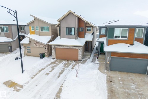 Contemporary house with a residential view, stone siding, and a garage - 19286 22A Avenue, Edmonton, AB 