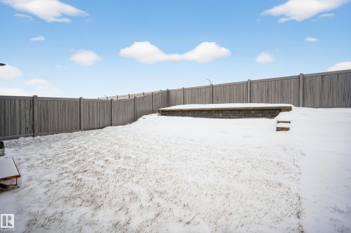 Snowy yard with a fenced backyard - 19286 22A Avenue, Edmonton, AB 