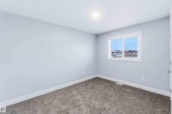 Spare room with baseboards and carpet floors - 
