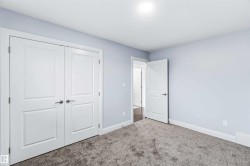 Unfurnished bedroom featuring carpet floors and a closet - 