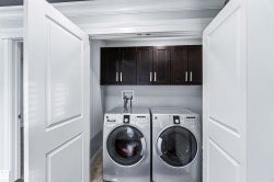 Laundry area with cabinet space and washer and clothes dryer - 
