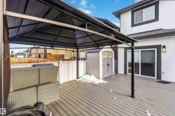 Deck featuring a storage unit and a gazebo - 