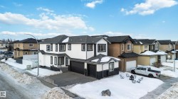 Traditional-style house with a residential view and stucco siding - 