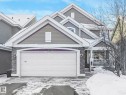 View of front facade with stone siding and driveway - 960 Summerside Link, Edmonton, AB  - Outdoor 