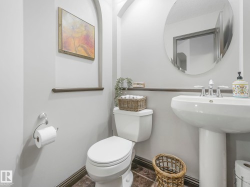 Bathroom with toilet and baseboards - 960 Summerside Link, Edmonton, AB - Indoor Photo Showing Bathroom