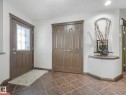 Entryway with a textured ceiling and baseboards - 960 Summerside Link, Edmonton, AB  - Indoor Photo Showing Other Room 