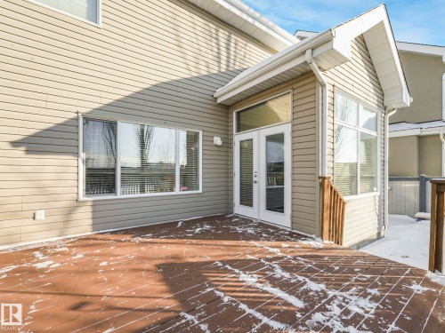 View of patio / terrace featuring french doors and a deck - 960 Summerside Link, Edmonton, AB - Outdoor With Exterior