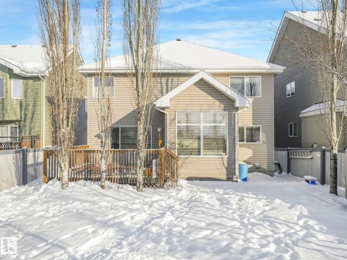 Snow covered property featuring a wooden deck - 960 Summerside Link, Edmonton, AB - Outdoor