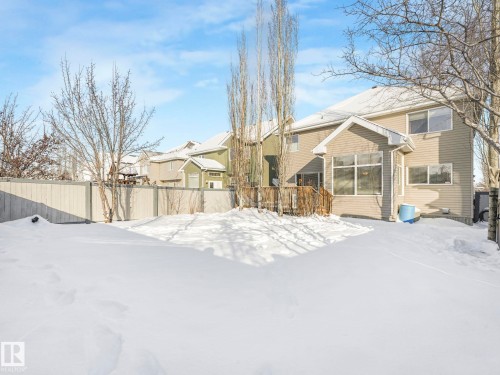 View of snow covered back of property - 960 Summerside Link, Edmonton, AB - Outdoor