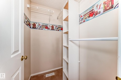 View of walk in closet - 3208 29 Avenue, Edmonton, AB - Indoor With Storage