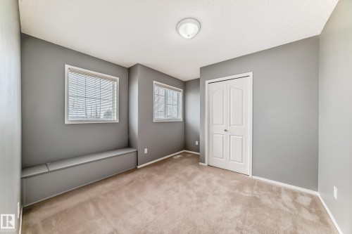 Unfurnished bedroom with light colored carpet and a closet - 3208 29 Avenue, Edmonton, AB - Indoor Photo Showing Other Room