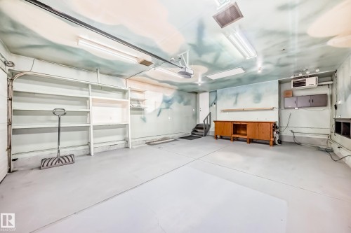 Garage featuring a heating unit and a garage door opener - 3208 29 Avenue, Edmonton, AB - Indoor Photo Showing Garage