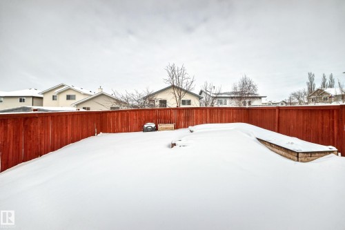 Yard covered in snow with a fenced backyard - 3208 29 Avenue, Edmonton, AB - Outdoor