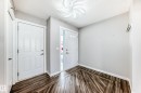 Entryway with dark wood-style flooring and a textured ceiling - 3208 29 Avenue, Edmonton, AB  - Indoor Photo Showing Other Room 