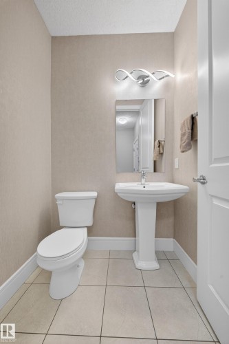Bathroom with light tile patterned flooring - 1907 Adamson Terrace, Edmonton, AB - Indoor Photo Showing Bathroom