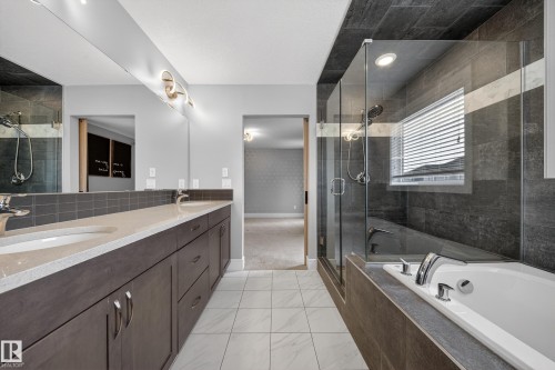 Bathroom featuring double vanity, a stall shower, and a garden tub - 1907 Adamson Terrace, Edmonton, AB - Indoor Photo Showing Bathroom