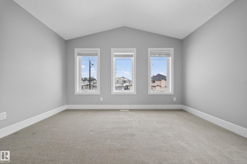 Empty room with light colored carpet and baseboards - 1907 Adamson Terrace, Edmonton, AB - Indoor Photo Showing Other Room