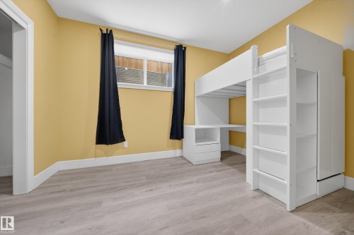 Unfurnished bedroom with baseboards and light wood-type flooring - 1907 Adamson Terrace, Edmonton, AB - Indoor