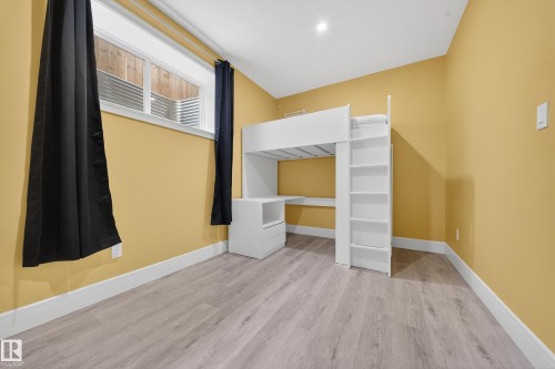 Unfurnished bedroom featuring light wood-style flooring and baseboards - 1907 Adamson Terrace, Edmonton, AB - Indoor