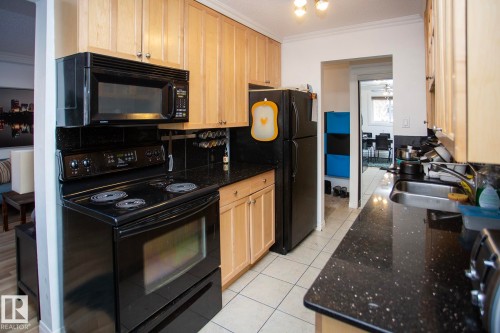 104 9925 83 Avenue, Edmonton, AB - Indoor Photo Showing Kitchen With Double Sink
