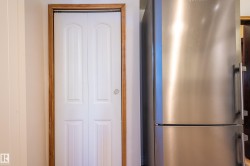 Kitchen view of freestanding refrigerator - 