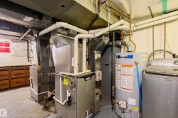 Utilities featuring washer / clothes dryer and gas water heater - 